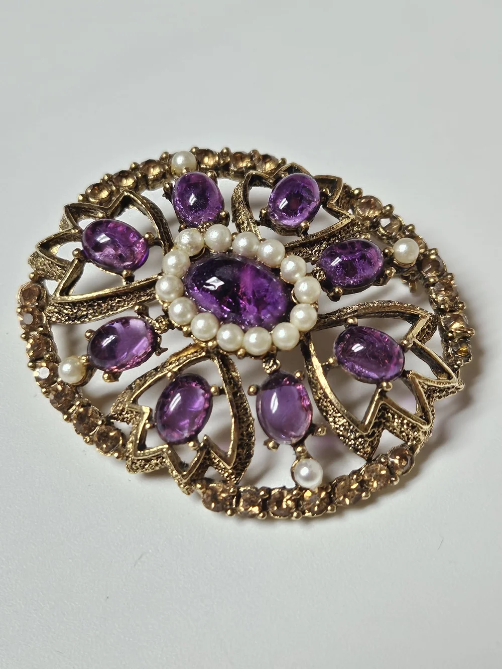 Gold-Tone Brooch with Purple Cabochons and Pearl Halo